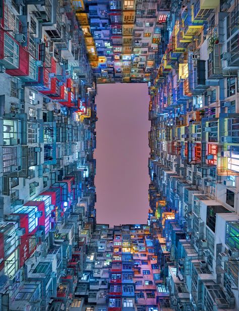 Welcome to one of Hong Kong's most Instagrammable locations — The "Monster Building" at Yik Cheong and Montane Mansion. Together, these residential buildings create dense geometric patterns in sharp contrast to the clear sky above, making the area an eye-catching destination for photographers and filmmakers alike.  Photo by Trey Ratcliff Hongkong Buildings, Monster Building, City Gallery, Cyberpunk City, Clear Sky, Concrete Jungle, Photo Memories, City Photography, City Buildings