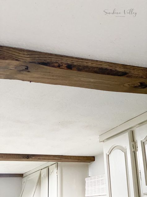 If you love the look of beams but hate the price tag that comes along with them, I'm sharing how we DIYed these real wood faux beams on a budget! Diy Wood Beams, Beam In Kitchen, Kitchen Cabinets To Ceiling, Faux Ceiling Beams, Cabinets To Ceiling, European Cottage, Faux Beams, Faux Wood Beams, Concrete Fireplace