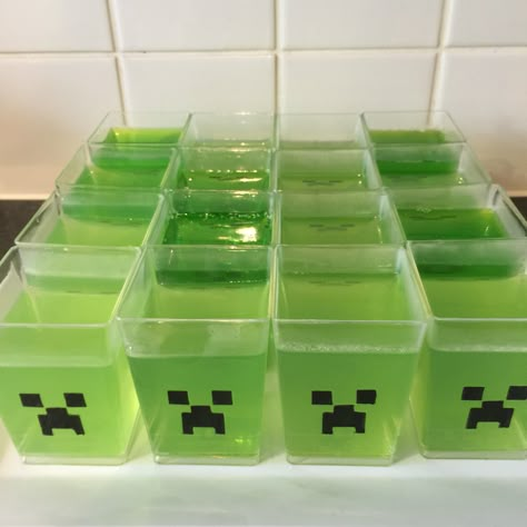 Minecraft party food ideas creeper jelly jello cups Minecraft Party Desserts, Minecraft Zombie Birthday Party, Dollar Tree Minecraft Party, Minecraft Party Invite, Creeper Birthday Party, Minecraft Dessert Table, Minecraft 8th Birthday Party, Minecraft Sleepover Party, Minecraft Birthday Food Ideas