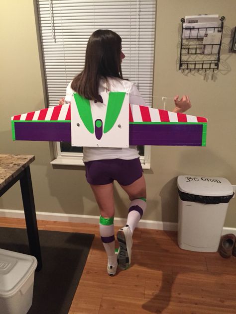 My DIY buzz light year wings that expand Diy Out Of This World Costume, Buzz Wings Diy, Buzz Light Year Diy Costume, Buzz Light Year Wings Diy, Buzz Lightyear Wings Diy, Diy Buzz Lightyear Wings, Diy Buzz Light Year Costume, Diy Buzz Light Year Costume Women, Buzz Light Year Costume