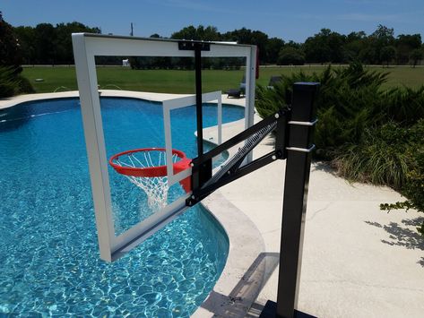 The HydroChamp Swimming Pool Basketball Hoop makes a great unit for adjustable poolside basketball.  The bolt down 4"x4" stainless steel post and adjustable carbon steel arm system combine for a durable, economical and aesthetically pleasing poolside unit.  All components are powdercoated black. Pool Basketball Hoop, Diy Basketball, Yard Oasis, Inground Pool Landscaping, Pool Basketball, House Pool, Pool Fun, Diy Swimming Pool, Pools Backyard