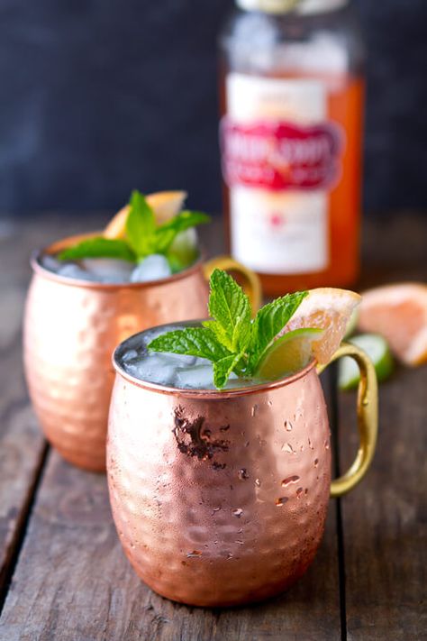 A delicious riff on the classic mule, this Ruby Red Moscow Mule cocktail uses Deep Eddy Ruby Red Vodka, lime and ginger. Sweet, tart and refreshing! #moscowmule #cocktail #cocktailrecipes Coffe Drinks, Friday Cocktails, Vodka Recipes Drinks, Grapefruit Vodka, Moscow Mule Cocktail, Moscow Mule Recipe, Mule Cocktail, Mule Recipe, Vodka Recipes