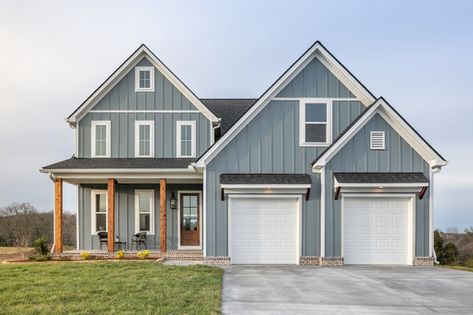 Blue Exterior House Colors Farmhouse, Dark Blue Hardie Board Siding, Gray Sided Houses, Blue Grey Siding Houses, Light Blue Board And Batten Exterior, Blue House Garage Door Color, Blue House With Wood Accents, Coastal Siding Exterior, Light Blue Siding House