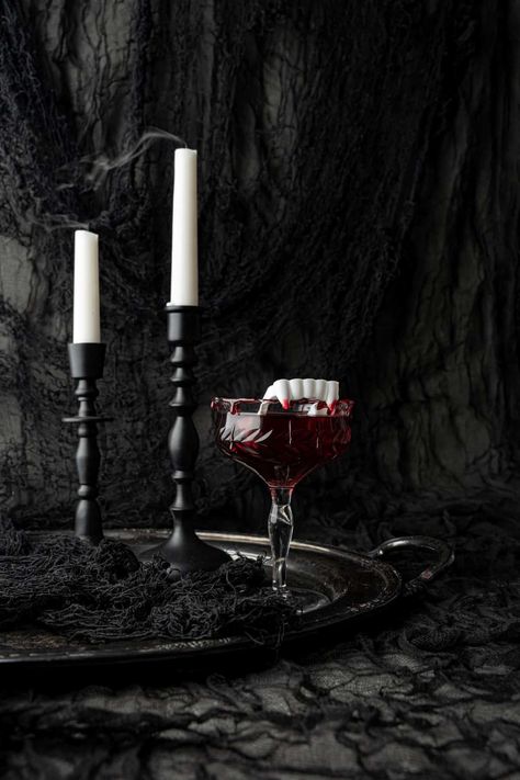 This Dracula's Kiss - Halloween Cocktail is the perfect libation for your haunting hour beverage. Vodka, cranberry juice, black cherry juice, vampire teeth and of course, the perfect blood dripping rim! Black Cherry Juice, Haunting Hour, Vodka Cranberry, Halloween Drinks Alcohol, Cranberry Juice Cocktail, Halloween Cocktail, Red Cocktails, Halloween Photography, Vampire Teeth