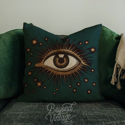 This Phthalo green evil eye pillow adds a touch of dark luxury to your decor. It's deep and dramatic, perfect for moody decor enthusiasts and also perfect for Halloween!. A printed evil eye symbol adds a touch of edge without being too much. The soft faux suede is surprisingly easy to clean and looks great blended in with other pillows. .: 100% Faux suede cover .: Double sided print .: Concealed zipper .: Pillow not included .: Advised to use inserts which are 2" larger than the cover for a full Subtle Goth Home Decor, Printed Pillow Covers, Dark And Moody Apartment, Emerald Home Decor, Witchy Throw Pillows, Witchcore Home Decor, Whimsigoth Interior Design, Dark Apartment Decor, Green Witch Bedroom