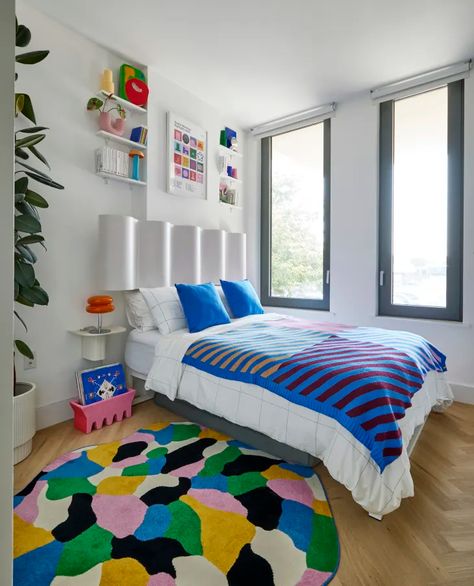 Tour a Bold Bushwick Apartment Exploding With Color | Apartment Therapy Wavy Headboard, Color Apartment, Blanket On Bed, Spanish Aesthetic, Room With Color, Colourful Bedroom, Multicolored Rug, Striped Blanket, Bed In Corner