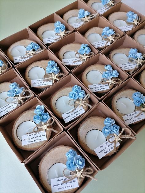 Beach wedding favors blue, Wedding Starfish Candle favors, Rustic wedding favors, Personalized favors in bulk,Baby shower favors; Unique gifts decorated with log candle holder, candles, paper blue rose flowers, natural starfish, personalized tag and jute rope ribbon. These gifts will make your guests ones happy.  *Candle holder dimensions: 7-8 cm. / 2.75-3.14 inc. *Box dimensions: 8x8x3 cm. (The box is included in the price) *For box packaging; -jute rope ribbon *I am using real/natural starfish Nautical Wedding Favors, Blue Wedding Favors, Handmade Party Favors, Baby Blue Weddings, Blue Beach Wedding, Log Candles, Beach Wedding Colors, Shell Crafts Diy, Wedding Shower Favors