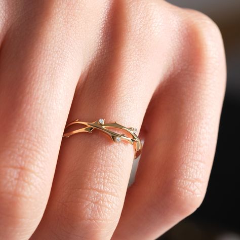 This gold and diamond ring draws inspiration from Gaea, the Earth Mother of Greek mythology. It symbolizes a profound connection to the natural world, emphasizing ecological balance and deep respect for the Earth. The delicate twig design represents life-giving energy and the eternal cycles of birth, growth, and renewal.  Wearing this ring serves as a reminder to ground one's energy, fostering harmony with the Earth. Embodying themes of nature, fertility, stability, protection, and primal power, Gold Vine Jewelry, Diamond Ring Drawing, Vine Wedding Band, Gold Twig Ring, Ring Gold Diamond, Vine Jewelry, Gold Twigs, Stackable Rings Wedding, Twig Ring