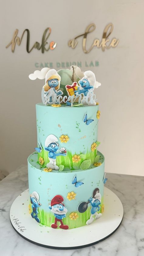 The Smurfs theme two-layer cake.  #CakeArt #CakeDesign #CakeDecor #BirthdayCake #TwoLayerCake #TheSmurfsCake Strumfovi Cake, Cake Smurfs, Smurf Birthday Cake, Smurf Theme, Smurfs Birthday, Smurfs Cake, Baby Boy Birthday Cake, Two Layer Cakes, Buttercream Cake Designs