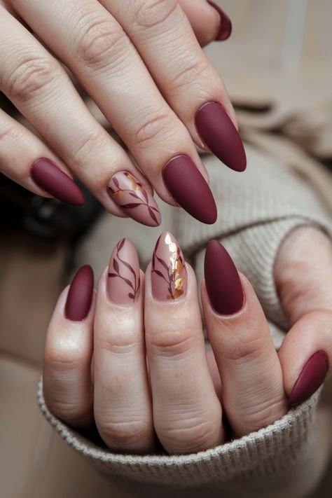 Embrace the cozy spirit of autumn with these stunning matte fall nail ideas that bring a touch of elegance to your look. Picture deep burgundy and rustic orange shades, perfectly muted for a sophisticated finish. These nails not only celebrate the changing season but also add a trendy twist to your style. Get ready to flaunt your fall vibes and inspire others with this chic matte design! Fall Season Nails Matte, Maroon Matte Nails Design, Autumn Nails Burgundy, Matte Burgundy Nails Design, Matte Fall Nail Designs, Fall Matte Nail Designs, Matte Autumn Nails, Terracotta Nails Designs, Neutral Matte Nails