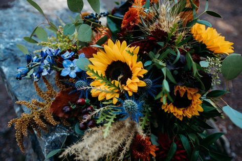 Fall wedding Elopement in Glacier National Park Sunflowers And Blue Flowers, Blue Eryngium, Flowers 2023, Blue Flower Arrangements, Fall Elopement, Fall Tones, Wedding Aesthetics, Alpine Design, Fall Flower Arrangements