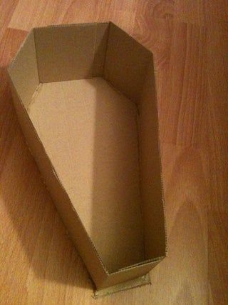 Easy Halloween Coffin : 8 Steps - Instructables Diy Coffin Halloween Cardboard, How To Make A Coffin Out Of Cardboard, Cardboard Coffin Diy, Halloween Coffin Decoration, Cardboard Coffin, Rip 20s, Egyptian Halloween, Coffin Decor, Zombie Prom