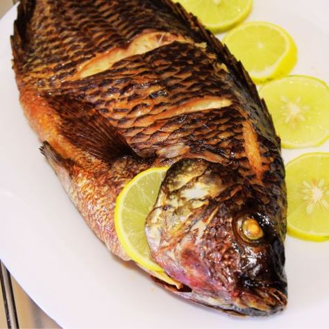 Oven-Baked Whole Tilapia Recipe Tilapia In The Oven, Whole Tilapia Recipes, Ways To Cook Tilapia, Whole Tilapia, Fried Tilapia, Tilapia Recipe, Baked Tilapia, Fish Varieties, Tilapia Recipes