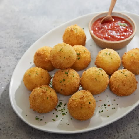 Arancini Recipe - Magnolia Magnolia Recipes, Magnolia Table Recipes, Joanna Gaines Recipes, Party Nibbles, Arancini Recipe, Party Side Dishes, Magnolia Network, Magnolia Kitchen, Marinara Sauce Recipe