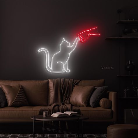 Light up any space with our Cat and Hand Neon Sign--a whimsical and eye-catching addition perfect for cat lovers. This unique Punch and Cat Neon Sign adds charm to bedrooms, pet shops, and kid's rooms, making it an ideal gift for pet enthusiasts or a playful decor piece for any space. Purpose of Use: Home decoration Party Decor Business decor A thoughtful gift for family, friends, or cat lovers ✨ Features: Handmade and user-friendly for a unique touch Durable and vibrant, perfect for dark settings Versatile and customizable for various events and room decor 🎨 Available Colors: Warm White, White, Yellow, Golden, Orange, Blue, Ice Blue, Green, Pink, Red, Purple, Teal 🔧 Materials: Made with high-quality Neon Flex Supported by a sturdy Acrylic frame 🔌 Specifications: Operates on a 12V volta Cat Neon Sign, Bedroom Neon Sign, Bedroom Neon, Cat Sign, Neon Cat, Decor Business, Neon Flex, Playful Decor, Acrylic Frame