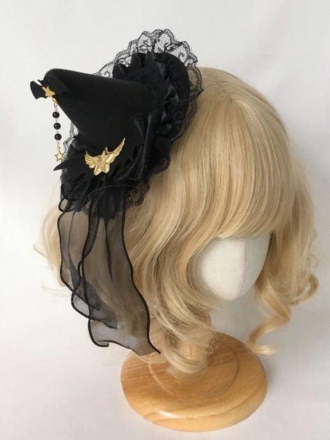 Unleash your inner sorceress with our gold stars black gothic witch mini hat. This captivating accessory is perfect for adding a touch of dark elegance to your ensemble. Crafted from high-quality, durable materials, this mini hat features a striking black base adorned with gold stars, exuding an aura of mystical allure.  Whether you're attending a gothic-themed event, a Halloween party, or simply embracing your witchy aesthetic, this mini hat is the perfect finishing touch to your bewitching loo Witch Aesthetic Hair, Witch Cosplay Ideas, Emo Items, Witch Hat Outfit, Witch Hat Aesthetic, Dark Witch Costume, Witch Hairstyles, Small Witch Hat, Witch Hat Costume