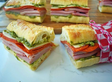 Italian Pressed Sandwicheswith Italian meats and cheeses layered with pesto sauce, marinated tomatoes, and thinly shaved lettuce all on a french baguette. Italian Sub Sandwich, Pressed Sandwiches, Italian Sandwich Recipes, Easy French Bread Recipe, Easy French Bread, French Bread Loaf, French Loaf, Make A Sandwich, Modern Honey