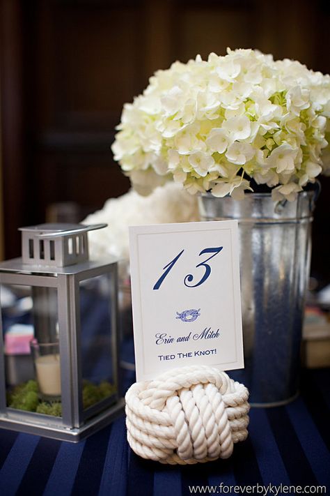 Non-Floral Centerpieces For Your South Florida Wedding | Partyspace.com Articles Beach Wedding Table Numbers, Rope Table, Non Floral Centerpieces, Beach Wedding Tables, Wedding Table Number Holders, Wedding Knot, Blue Beach Wedding, Table Markers, Nautical Table