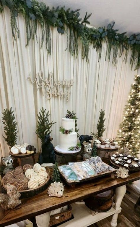 35+ Winter Wonderland Baby Shower Ideas You'll Swoon Over - One Sweet Nursery Winter Woodland Dessert Table, Evergreen Baby Shower Theme, Dark Forest Baby Shower Ideas, Woodland Forest Baby Shower Theme, January Baby Boy Shower Ideas, Boy Baby Shower Woodland Theme, Bridal Shower Forest Theme, Woodland Baby Shower Dessert Table, Christmas Baby Shower Table Decor