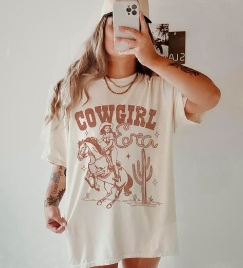 I’m a Cowgirl baby! Country Graphic Tees, Cowgirl Era, Cowgirl Baby, Western Graphic Tees, Dtf Transfers, The Space, Tee Design, Concert Outfit, Shop Design