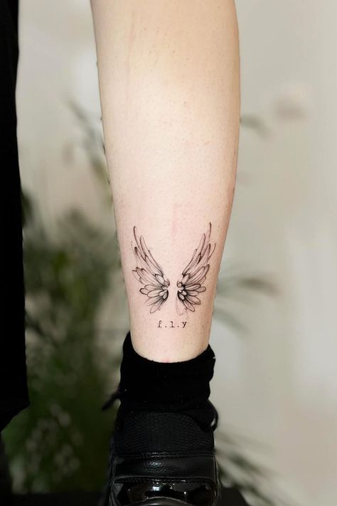 Unlock the symbolism of wings tattoos – a fusion of freedom, spirituality, and celestial beauty. Explore the allure now! #wingstattoo #wingstattoos #tattooart Wings Tattoo On Leg, Set Hairstyles, Person Tattoo, Wings Tattoos, Font Tato, Gothic Tattoos, Tattoo On Leg, Freedom Tattoos, Tato Minimal