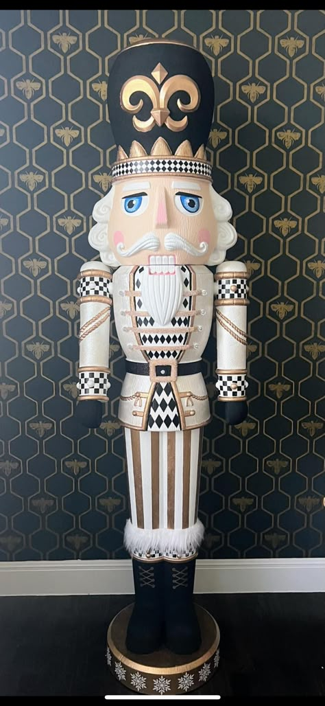 Nutcracker Yard Art, Nutcracker Black And White, Walmart Peppermint Nutcracker Makeover, Cool Nutcrackers, Black And Gold Nutcracker, Painting Nutcrackers Diy, Painting A Nutcracker Diy, Diy Nutcracker Painting Ideas, Walmart Nutcracker Painting Ideas