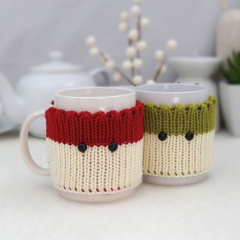 This knitted tea, coffee or cocoa mug cozies are thick enough to protect your fingers and keep beverage hot longer in your cup. Set of 2. Cozies colors: Ivory / Green Apple; Ivory / Red. Decorated with Black Eyes buttons. Made of acrylic yarn. 2 layers thick. Great Christmas gift. Nice addition to home decor. Fits standard size mug (not included). #mugcozy #cupcozy #cupsleeve #christmas #christmasgift #coffeemugcozy #birthdaygift #coffeelover #tealover #knitcrochet #morningtea Knitted Cozy, Mug Cozies, Knit Cup Cozy, Teapot Cozy, Mug Cozy, Cup Sleeve, Tea Lovers Gift, Cup Cozy, Black Eyes