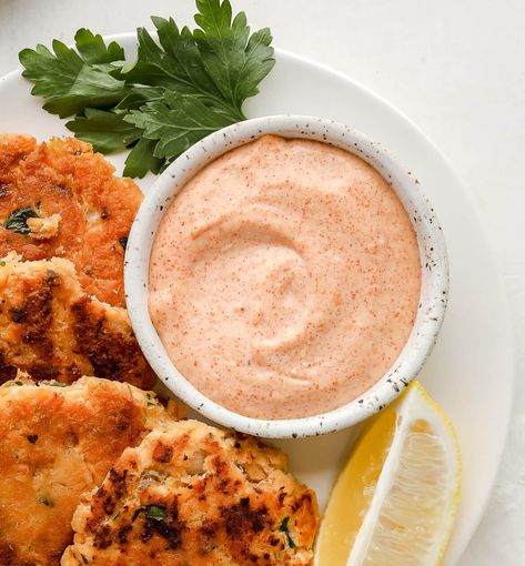 These crispy salmon patties make a delicious meal or appetizer in a pinch! Paired with creamy remoulade sauce, you'll keep coming back for seconds! The best part? They're Keto + Whole30 compliant. Salmon Pattie Dipping Sauce, Salmon Burger Aioli, Salmon Cakes Dipping Sauce, Salmon Patties Sauce Recipes, Dip For Salmon Patties, Salmon Croquettes Dipping Sauce, Salmon Patties Dipping Sauce, Salmon Burger Recipe Sauce, Sauce For Salmon Croquettes