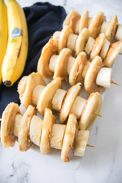 One of our favorite things to do on Saturday morning is head downstairs and whip up a big batch of pancakes. One morning, we decided to switch things up a bit and try making Peanut Butter and Banana Pancake Kabobs. We had so much fun with this fun twist on traditional pancakes, and it has become a favorite go-to breakfast idea in our house. The first step is mixing up your favorite pancake batter! Then it's time to build your breakfast kabobs. Things To Do On Saturday, Breakfast Kabobs, Pancake Kabobs, Kabob Sticks, Making Peanut Butter, Peanut Butter And Banana, Banana Pancake, On The Go Snacks, Breakfast Idea