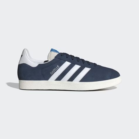 Slip into street-smart style with the adidas Gazelle shoes. Introduced in 1966 as a training shoe, the Gazelle has stood the test of time. It now serves as a bold icon, taking you from work to weekend without missing a beat. The suede upper and rubber outsole team up to deliver a vintage look with modern-day comfort. Once worn by athletes, now worn by all, the Gazelle continues to turn heads decades after its debut. Adidas Shoes Gazelle, Adidas Gazelle Shoes, Gazelle Shoes, Mens Lifestyle, Adidas Shop, Adidas Gazelle, Athletic Sneakers, Blue Adidas, Adidas Online