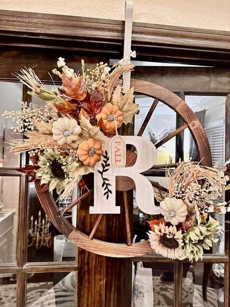 Wagon Wheel Crafts, Wagon Wheel Decor Outdoor Porch, Fall Wagon Wheel Wreath, Boho Wagon Wheel Wreath, Wagon Wheel Wall Decor Ideas, Wagon Wheel Wedding Decor, Decorated Wagon Wheel, Bicycle Wheel Wreath Fall, Wagon Wheel Wreath Rustic