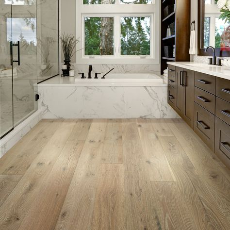 From waterproof (real!) hardwood floors to luxury vinyl, we've uncovered the 5 best flooring options for a bathroom remodel. #bathroomdesign #bathroomflooring #tilebathroom #flooringforbathroom          #bathroomrenovation European White Oak Floors, Basement Reno, How To Waterproof Wood, Waterproof Bathroom, Floor Bathroom, Oak Hardwood Flooring, White Oak Floors, White Oak Wood, Basement Flooring