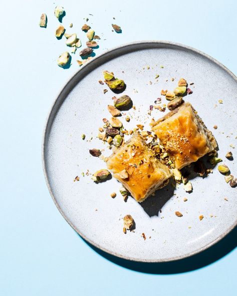 mezze dishes with sunny, harsh lighting and minimal styling. food photo with blue backdrop Baklava Photography Styling, Cold Baklava, Baklava Photography, Harsh Lighting, Christmas Content, Blue Backdrop, Blue Food, Blue Backdrops, Baklava