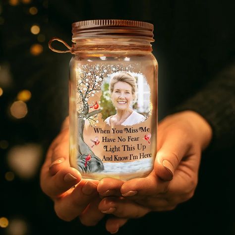 The Custom Photo Mason Jar Light is more than just a luminary; it's a heartfelt memorial and a cherished gift for any occasion. Customizable with a photo and the touching message "When You Miss Me, Have No Fear, Light This Up And Know I'm Here," it serves as a beacon of comfort, especially for those coping with the loss of a loved one. This unique product encapsulates memories and emotions, making it an unforgettable gift for family members, be it for a father, mother, or anyone dear on any occa Memorial Crafts For Loved Ones, Memory Jars, Mason Jar Light, Holiday Homework, Personalized Mason Jars, Memory Jar, You Miss Me, Craft Market, Market Ideas