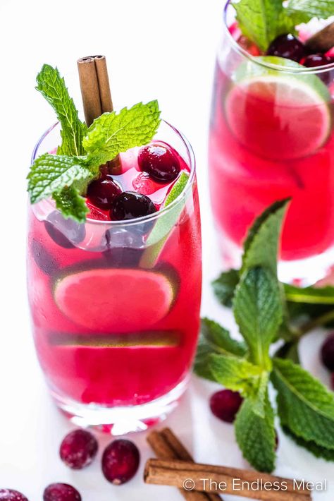 Deck the halls with this refreshing holiday-inspired cranberry mojito! It's a festive twist on the classic mojito with homemade spiced cranberry syrup, mint, and a little fizz. It's perfect for parties and sub-zero temperatures, and it's ready in just 20 minutes! #theendlessmeal #christmas #mojito #christmascocktail #cocktail #cranberry #cranberrymojito Christmas Mojito, Cranberry Mojito, Cranberry Syrup, Cinnamon Sticks Christmas, Apple Pucker, Mojito Ingredients, Classic Mojito, Christmas Cranberry, Gazpacho Recipe