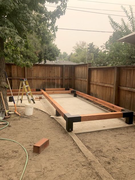 This modern pergola is a great backyard addition! It's the perfect family hangout spot. Click to get the DIY tutorial and links to the brackets and hardware we used. Pin to your backyard ideas, landscape design, and modern outdoor ideas! Craftsman Backyard, Outdoor Tile Patio, Back Porch Designs, Backyard Walkway, Diy Backyard Patio, Hangout Spot, Modern Pergola, Backyard Diy, Backyard Remodel