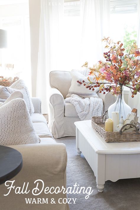 Add warmth and coziness to a family room with layers of cozy throws and pillows with accents of classic Fall colors- burnt orange, cream, reds. #couch #coffeetable #fallcolors #autumn #falldecorating Ella Claire, Autumn Cottage, Fall Bouquet, Fall Living Room, Vase Flowers, White Sofa, Rustic Fall Decor, Farmhouse Holiday, Autumn Decorating