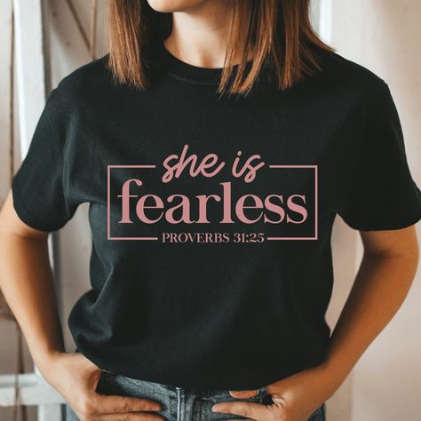 She is fearless Proverbs 31:25 Shirt, Faith Shirt, Religious Shirts, Lord Shirt, Christian shirt, Jesus Shirt, Unisex T-shirt Product Information All shirts are Unisex Gildan 100% Cotton. Please take a careful look at out sizing chart. Designs are applied with HTV (Heat Transferred Vinyl) and pressed with a Heat press. Washing Care Instructors Use cold water when washing, do not use bleach, do not dry clean, and do not use an iron directly on the design. Shipping Process * Your order will be rea She Is Fearless, Zombie Shirt, Christian Shirts Designs, Church Shirt, Jesus Shirt, Religious Shirt, Black Graphic Tees, Faith Shirt, Orange T Shirts