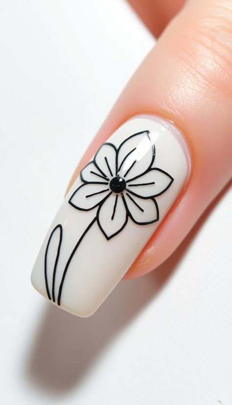 Depict delicate flowers with minimalist line drawings. A subtle nod to floral themes. #FlowerLineArt #BotanicalMinimalism Minimal Floral Nails, Black And White Nail Art Simple, Simple Flower Nail Art, Flower Nail Design, Black And White Nail Art, Simple Line Art, Flower Nail Designs, Flower Nail, Simple Flower