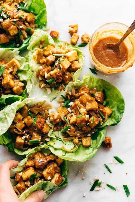 HELLO YUM. Firecracker Lettuce Wraps that are happily vegan - with crispy tofu bits, saucy brown rice noodles, and a creamy sesame sauce. #lettucewrap #vegan #tofu #veganlettucewrap #meatless #vegetarian | pinchofyum.com Tofu Lettuce Wraps, Brown Rice Noodles, Vegan Lettuce Wraps, Vegetarian Lettuce Wraps, Tofu Wraps, Tofu Tacos, Vegan Tofu, Sesame Sauce, Vegan Beans