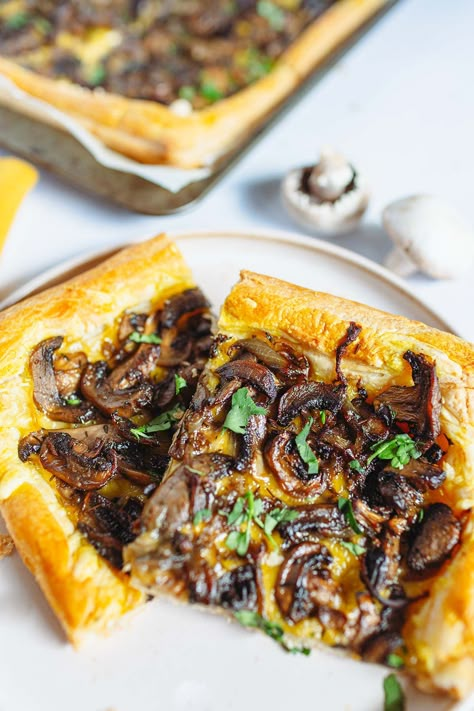 mushroom tart on a creamy plate and on a baking sheet, white mushrooms Vegan Pastry Savoury, Vegan Puff Pastry Dessert, Mushroom Puff Pastry Recipes, Vegan Puff Pastry Recipes Savory, Mushroom Onion Puff Pastry, Vegan Puff Pastry Recipes, Vegan Savoury Tart, Mushroom Puff Pastry Appetizers, Mushrooms In Puff Pastry