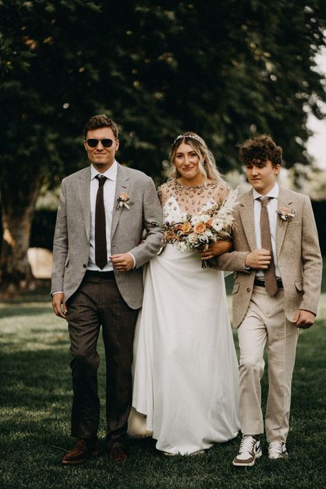 Bride walking down the aisle with her brothers | Image by Lukas Korynta Brother Of Bride Outfit, Brother Of The Bride Outfit, Bride And Brothers Pictures, Bride With Brothers Photo Ideas, Brother Of The Bride, Brothers Walking Sister Down Aisle, Brother Walking Sister Down Aisle, Bride Walking Down Aisle With Two Dads, Father Walking Bride Down Aisle