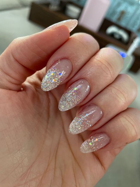 Pale Sparkle Nails, Clear Nail Base Designs, Sparkle French Almond Nails, Elegant Trendy Nails, New Years Nails Oval Shape, Clear Chunky Glitter Nails, Acrylic Nails Almond Sparkle, New Years Nails Almond Shape Short, Nails Inspiration Sparkle