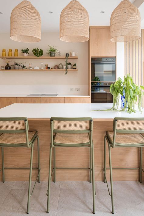 Scandinavian kitchen in London with central island, rattan lamspades, corian worktop and green bar stools Scandinavian Kitchens, Scandi Kitchen, Scandinavian Kitchen Design, London Kitchen, Sustainable Kitchen, Stools For Kitchen Island, Scandinavian Kitchen, Kitchen Diner, Kitchen Stools