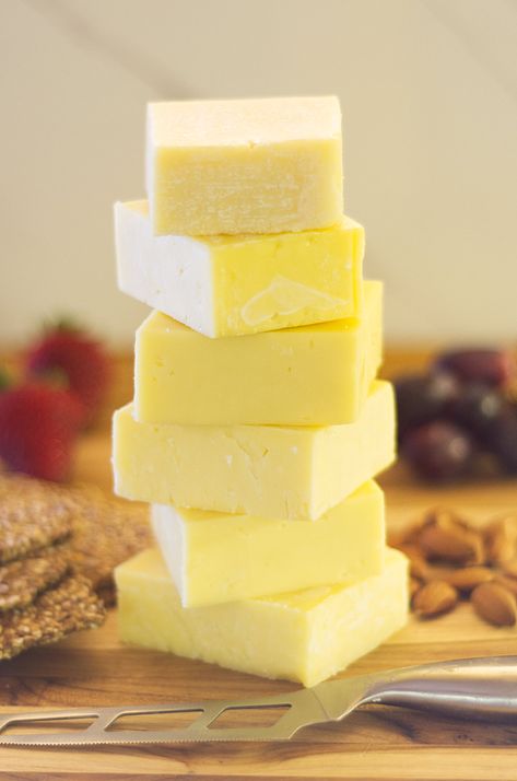 Stack of 6 cheeses with a cheese knife in front. Irish Cheese, Type Of Cheese, Irish Cheddar, Cheese Cheddar, Thanksgiving Dinner Ideas, Football Party Food, Somerset England, Irish Food, Cold Appetizers