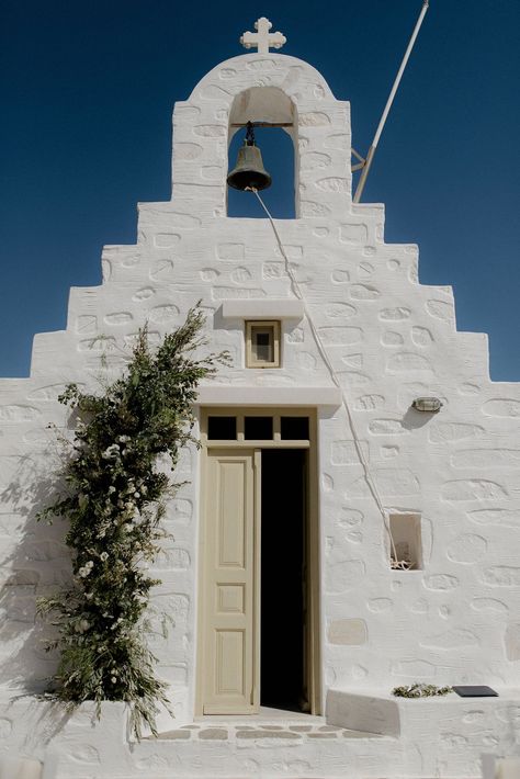 White wedding chapel in Paros, Greece at destination wedding with green and white flower arrangements Greek Chapel Wedding, Intimate Chapel Wedding, Wedding Greek Style, Small Greek Wedding, Greek Wedding Flowers, Greek Wedding Aesthetic, Antiparos Wedding, Greece Wedding Aesthetic, Green And White Flower Arrangements