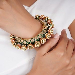 Buy this Traditional bangle crafted with 14k yellow gold electromagnetic plating and tarnish resistant Pearl Bangles Gold, Pearl Bangles, Beautiful Personality, Unique Bangle, Kundan Bangles, Bangles Gold, Brass Bangle, Pearl Bangle, Gold Wedding Jewelry