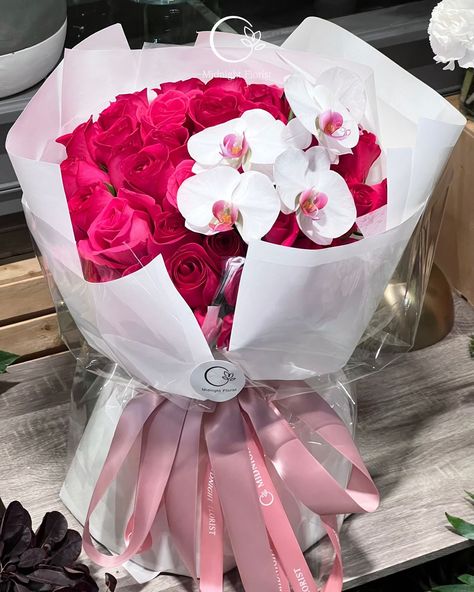 52 Pink Floyd roses paired with stunning orchids for the ultimate expression of love and luxury 💖✨ Elevate any moment with this bold, breathtaking bouquet. . #MidnightFlorist #LuxuryBouquet #PinkFloydRoses #OrchidLove#torontoflowershop #torontoflorist #torontolife #floraldesign #flowerbouquet #flowers #bouquet #flowers🌸 #flowerdesign#florist #floristlife #floristshop #floristry #florists #pinkfloyd #rosebouquet Roses And Orchids Bouquet, Orchids Bouquet, Luxury Bouquet, Canadian Dollar, Orchid Bouquet, Florist Shop, Expression Of Love, Rose Bouquet, Pink Floyd