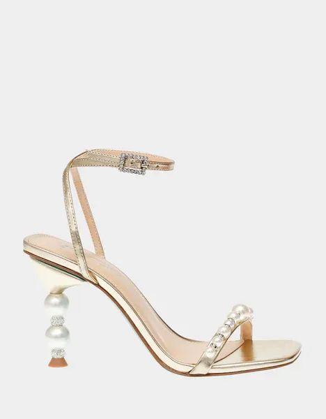 Step into timeless elegance with the JACY pearl heels. This luxurious heel is crafted from beautiful ivory pearls, ensuring you look your absolute best at any special occasion. Perfect for date nights and weddings alike, this gorgeous accessory will elevate your ensemble in a snap! #betseyjohnson #AD Gold Pearl Heels, Seashell Heels, Heels With Pearls, Pearl Heels, Pearl Shoes, Future Room, Cinderella Shoes, Prom Ideas, Betsey Johnson Shoes