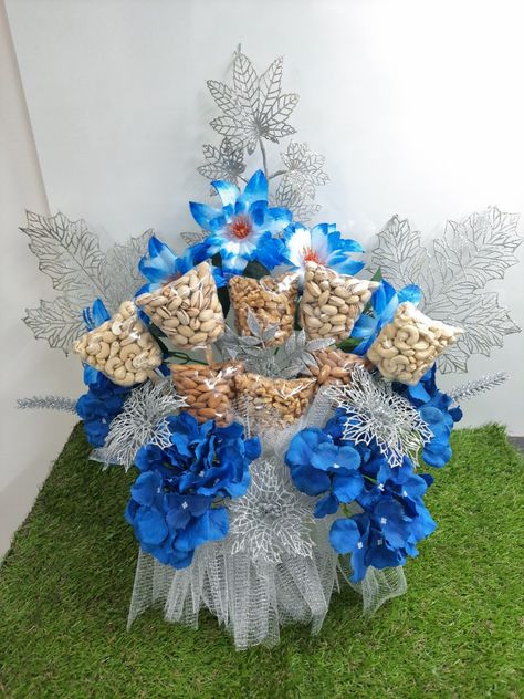 Gifting dry fruits in a Bouquet style with silver touch Dry Fruit Bouquet, Dryfruit Bouquet, Baat Pakki, Fruit Bouquet, Bridal Gift Wrapping Ideas, Flower Decorations Diy, Dry Fruit, Fruit Decorations, Dry Fruits